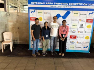  Experienced doctors and physiotherapists engaging with swimmers
